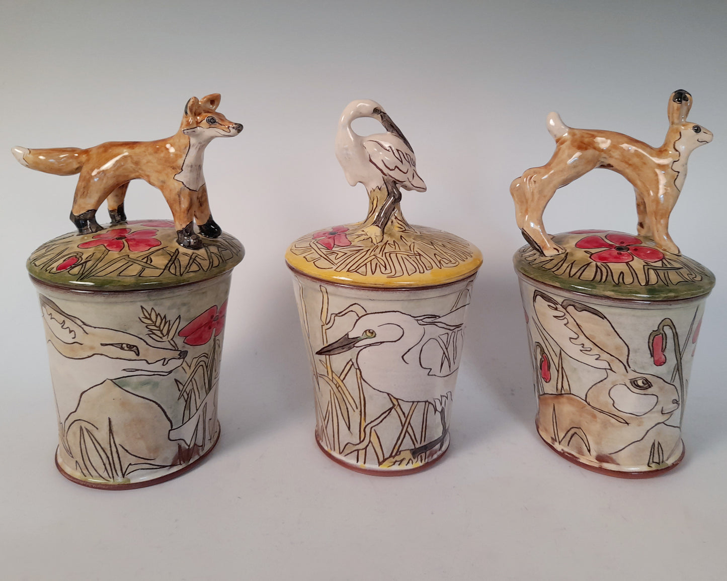 Fox store jar Earthenware decorated with drawings of fox and little fox sculpture.