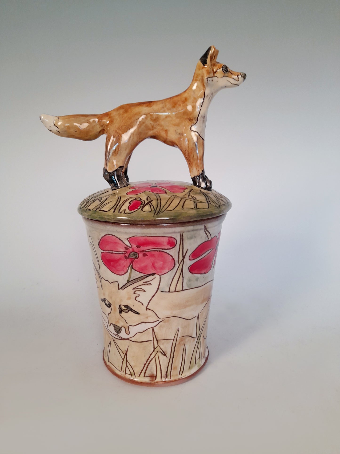Fox store jar Earthenware decorated with  drawings of fox and little fox sculpture.